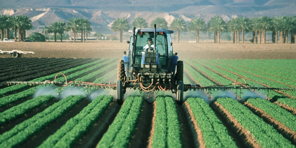 Pesticide spraying on a field