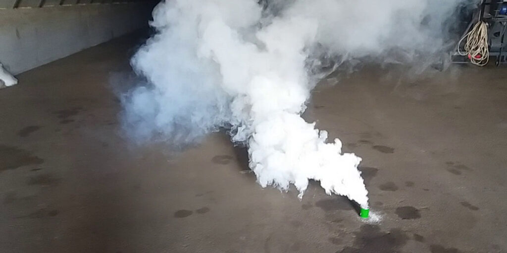 Fumigating a warehouse using a smoke fumigant tablet for pest control